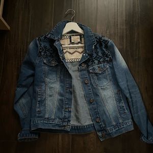 Jean jacket with black embroidered design